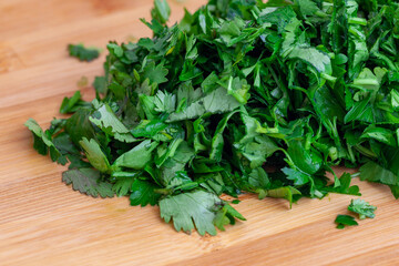 Chopped parsley on a wooden chopping board