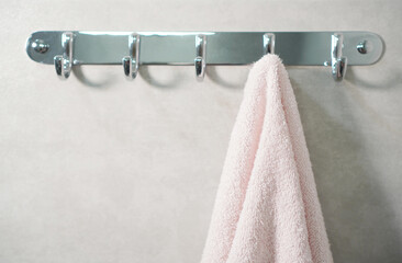Towel hanging on a wall in a bathroom