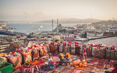 Great panoramic view of Istanbul from high terrace decorated traditional colorful ornamental pillows - obrazy, fototapety, plakaty