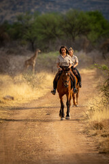 Brunette and blonde ride from southern giraffe