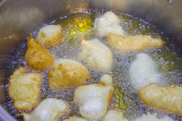 Pettole, typical fried dough from Southern Italy. They are made on the night of Santa Cecilia (22nd November, in Taranto) or St. Nicholas (6th December) and, more generally, at Christmas. 