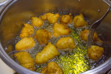 Pettole, typical fried dough from Southern Italy. They are made on the night of Santa Cecilia (22nd November, in Taranto) or St. Nicholas (6th December) and, more generally, at Christmas. 