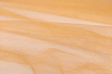 Silk fabric, organza is light beige, fabric wavy texture