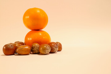 Close up of a two citrus fruits with some hazelnuts. Extra space for postcards. Isolated on a white background. Stockholm, Sweden.