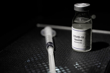 covid 19 corona virus vaccine injector black background