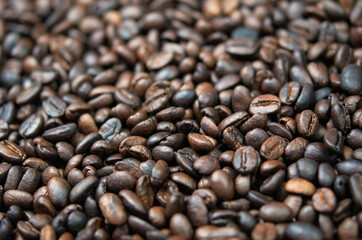 Fototapeta premium Dark roasted coffee beans close-up. Coffee background