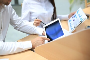 Asian business adviser meeting to analyze and discuss the situation on the financial report in the meeting room.Investment Consultant,Financial Consultant,Financial advisor and accounting concept