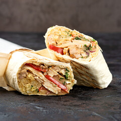 traditional oriental shawarma in Eco-friendly cardboard. dark stone surface. concept of eco packages of recyclables.