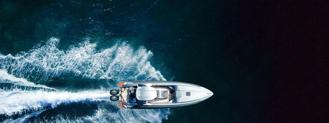 Aerial drone ultra wide panoramic photo of inflatable speed boat cruising in high speed in Mediterranean Aegean sea