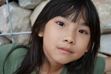 Portrait Asian cute child girl 7 years old smiling happy