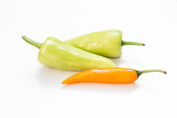 Fresh yellow and green chilli on white background, hot chilli from the farm in Thailand, organic vegetable