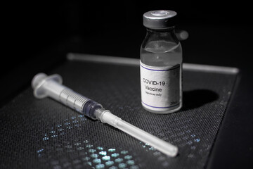 covid 19 corona virus vaccine injector black background