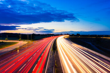 M1 motorway in England with evening traffic light trails