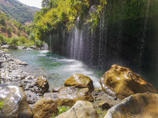 waterfall flowing in nature, cascade, cascade between rocks. Hakkari in Turkey
