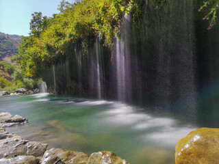 waterfall flowing in nature, cascade, cascade between rocks. Hakkari in Turkey
