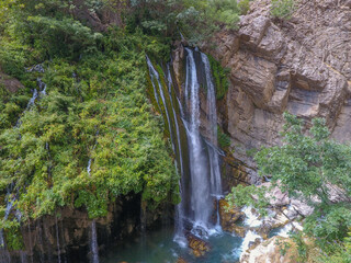 waterfall flowing in nature, cascade, cascade between rocks. Hakkari in Turkey
