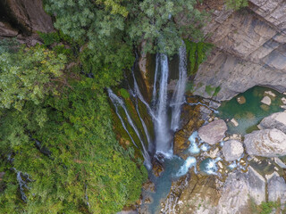 waterfall flowing in nature, cascade, cascade between rocks. Hakkari in Turkey
