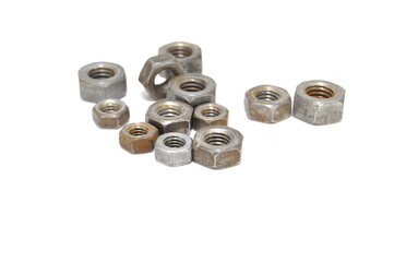 Rusty nuts on white background close-up. steel, thread, fasteners