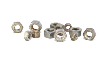 Rusty nuts on white background close-up. steel, thread, fasteners