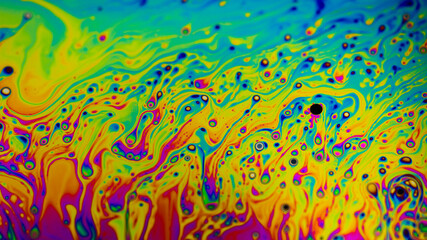 Extreme close-up of the colourful surface of a bubble