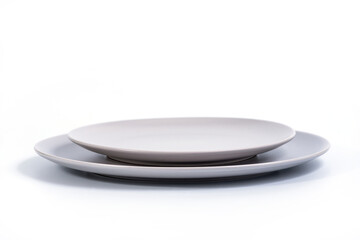 Grey Dish set - Large and small plates isolated on white background side view, selective focus