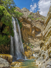waterfall flowing in nature, cascade, cascade between rocks. Hakkari in Turkey
