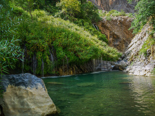 waterfall flowing in nature, cascade, cascade between rocks. Hakkari in Turkey
