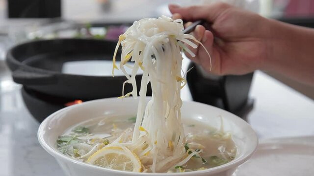  Vietnamese rice noodles made from beef, tendon, onion, host and coriander