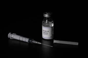 covid 19 corona virus cure vaccine injector syringe black background