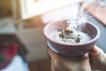 Traditional esoteric incense ritual at New Year and Christmas, smoke for cleaning the house