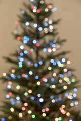 Blurred decorated Christmas tree on white background.