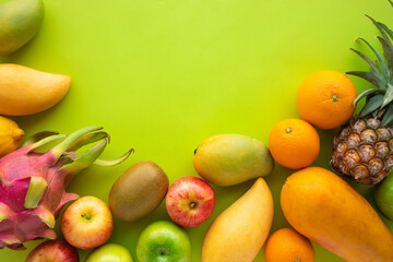 Group of fruits on green space