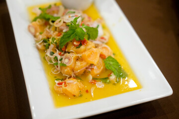 Thai style spicy salmon in white plate