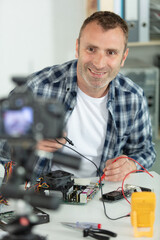 young caucasian blogger repairing electronice devices
