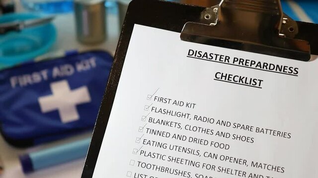 Clipboard with a list of  items your household may need during a disaster such as an earthquake, fire, flood or other emergency.
