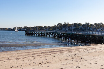 Fototapeta na wymiar Fishing Pier at Cummings Park Beach in Stamford Connecticut along Westcott Cove