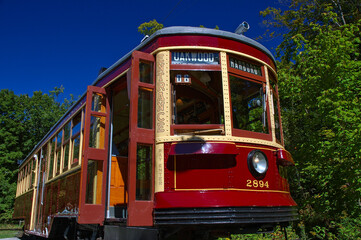 Antique red streetcar with open door