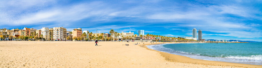 Fototapeta na wymiar Barceloneta beach panorama at sunny day. Barcelona. Spain