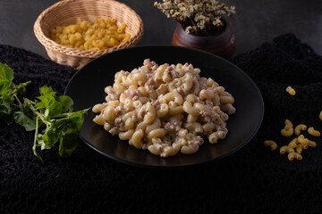 Macaroni Stir-fried with Carbonara Sauce in Black Plates