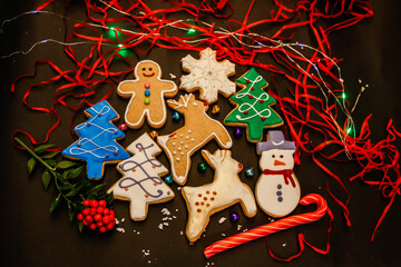 Gingerbread Christmas symbols, cookie set on a black background.