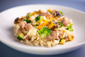 Risotto with vegetables, mushrooms and cheese. Traditional italian recipe. 