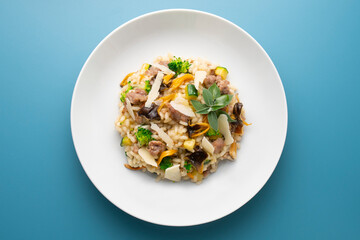 Risotto with vegetables, mushrooms and cheese. Traditional italian recipe. 