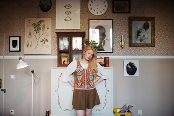 woman standing in an old vintage living room 