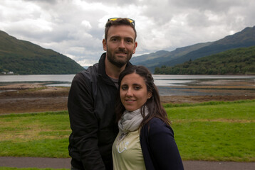 A young couple dressed in sports clothes enjoying Valentine's day outdoors.