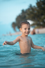 Happy boy have fun at sea