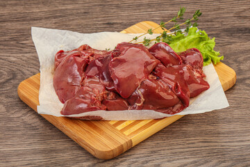Raw chicken liver over board
