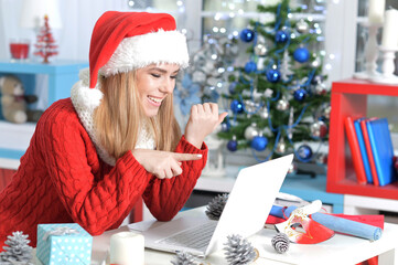 Portrait of young woman preparing for Christmas