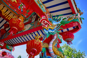dragon and lanterns in a Chinese temple during a sunny day 