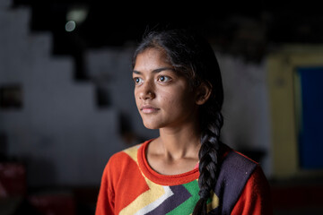 Dramatic portrait of an indian young girl in lowkey