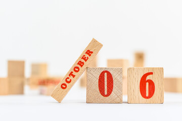 6th of October on the wooden calendar blocks on white background.